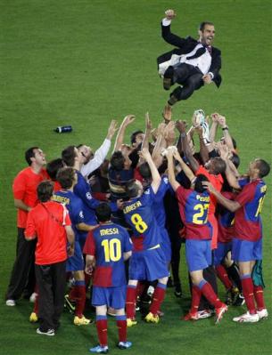 4190899564-barcelona-coach-pep-guardiola-is-thrown-in-the-air-in.jpg